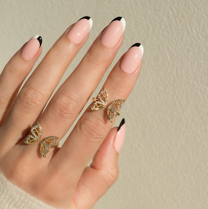 Butterfly ring with French tip nails