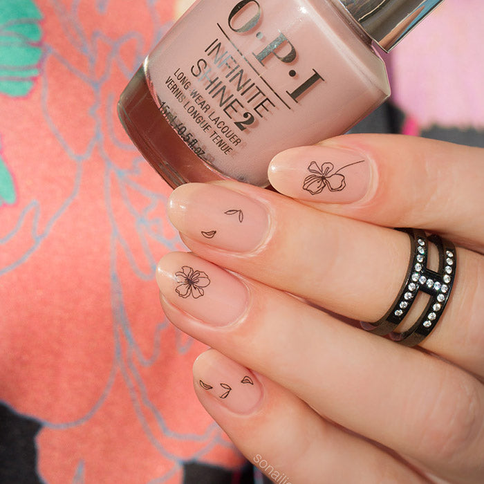 Nude and black nails with Ink Flower stickers