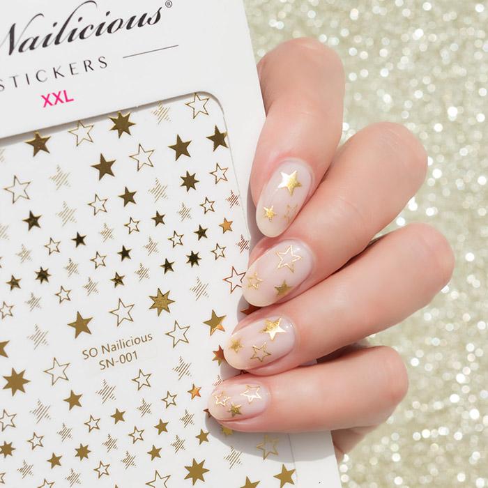 gold and nude nails with star stickers