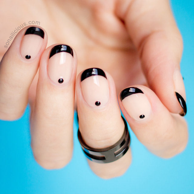 black and nude nails with black rhinestones