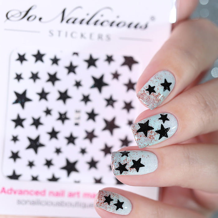 Star nails with black glitter star stickers