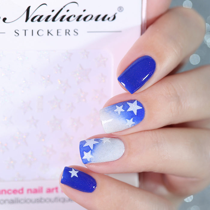 Blue nails with white glitter star stickers