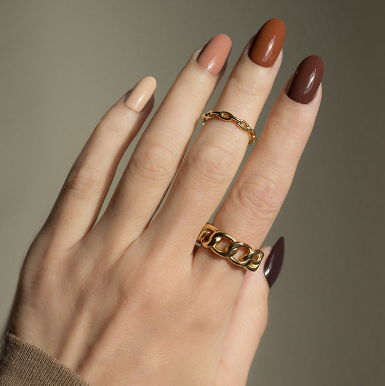Gold chain ring with brown nails