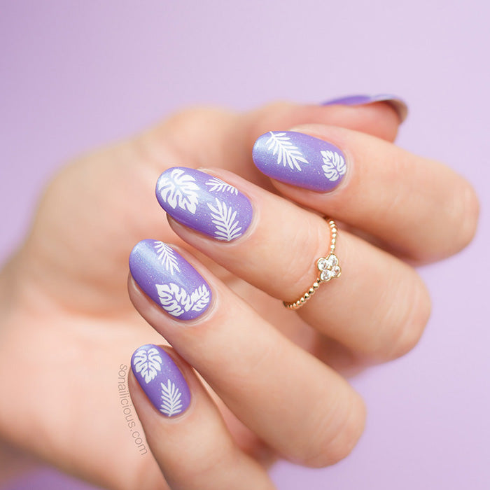 purple tropical nails with palm leaf stickers