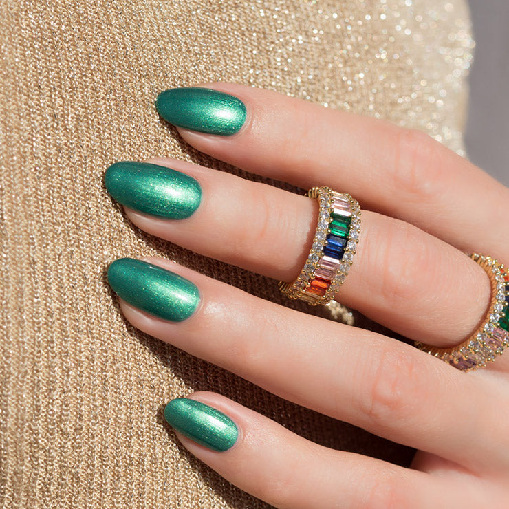 Opulent rainbow ring with emerald green nails