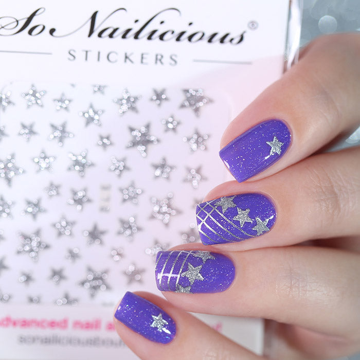 Purple nails with silver glitter star stickers
