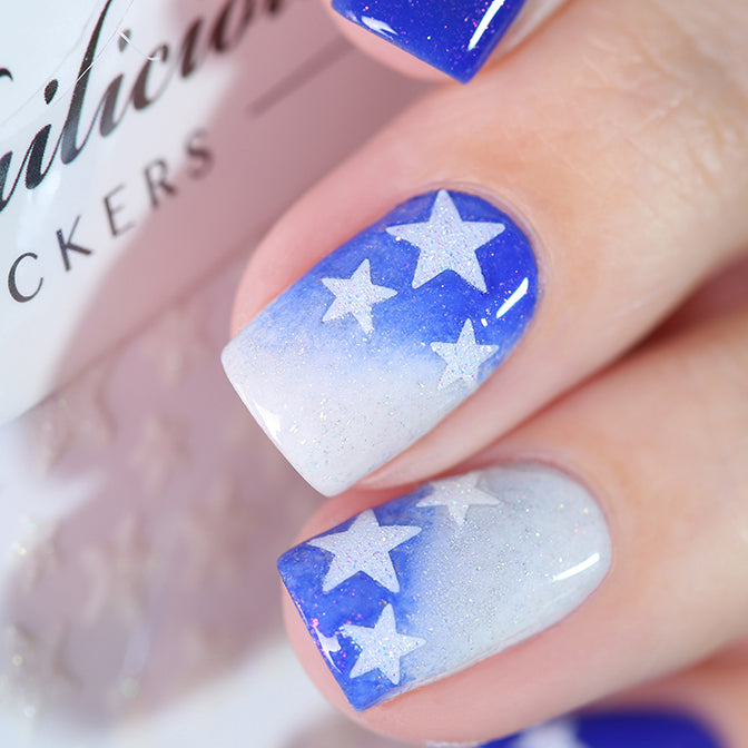 Blue nails with white glitter star stickers
